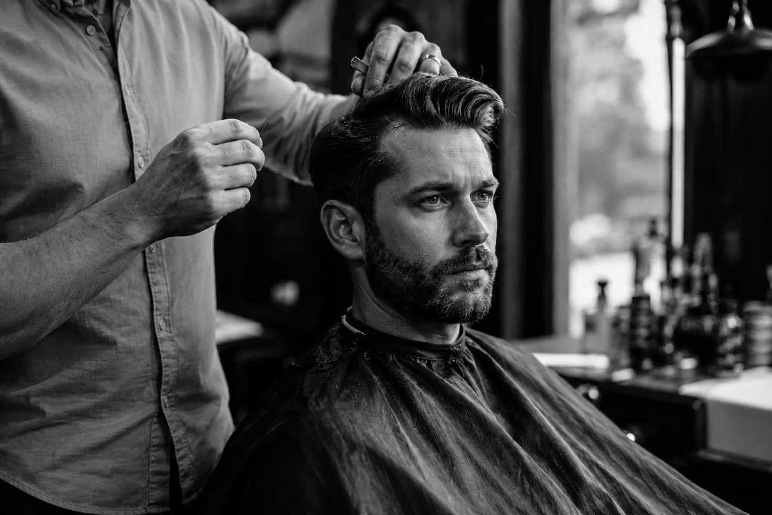 A barber cutting hair at Majidian Barbers in Kitsilano